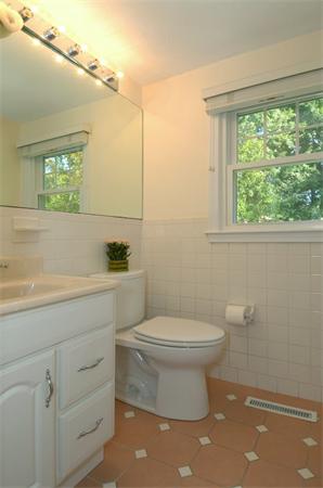 102 Standish Road Needham, MA 02492 - Photo 13 of 28 a bathroom with a toilet sink and mirror