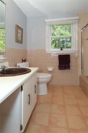 102 Standish Road Needham, MA 02492 - Photo 18 of 28 a bathroom with a sink a toilet and a window