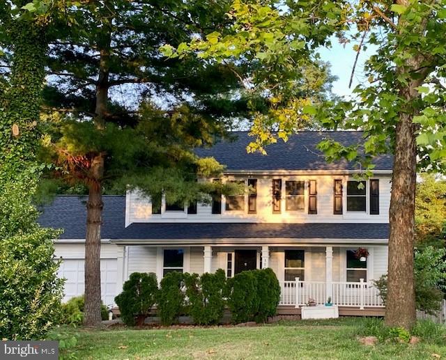 3909 Red Leaf Court Point of Rocks, MD 21777 - Photo 1 of 10 a front view of a house with a garden