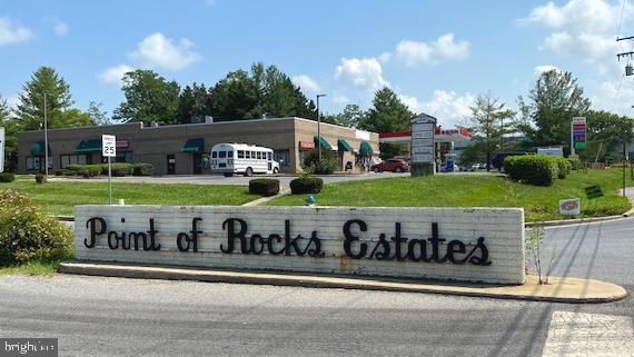 3909 Red Leaf Court Point of Rocks, MD 21777 - Photo 3 of 10 a view of a sign board with a big yard