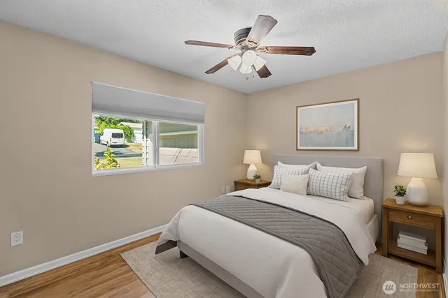 a bedroom with a bed and a window