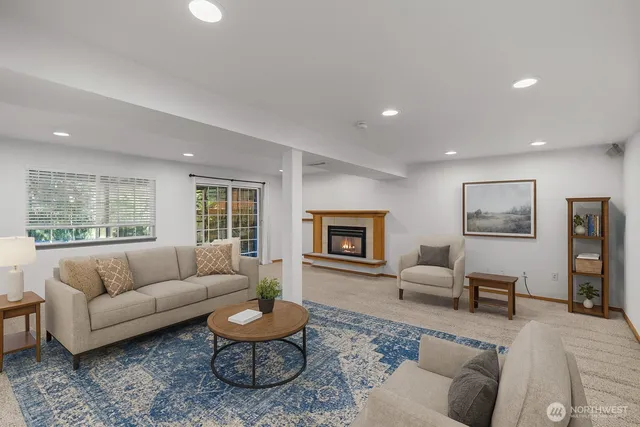 a living room with furniture and a large window