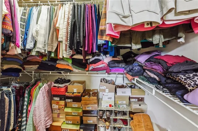 a bed room with a bed and a chandelier
