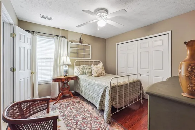 a bathroom with a sink a toilet and shower curtain