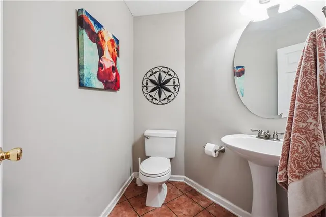 a bathroom with a toilet and a sink