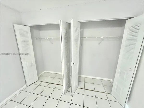 a view of an empty walk in closet