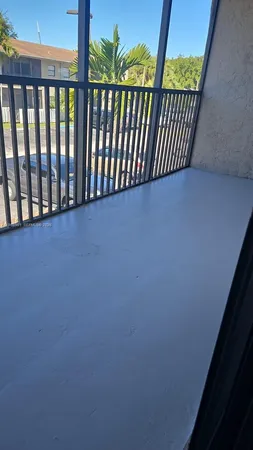 a view of balcony with wooden floor