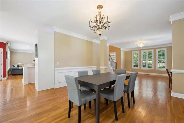 a living room with furniture a fireplace and a large window
