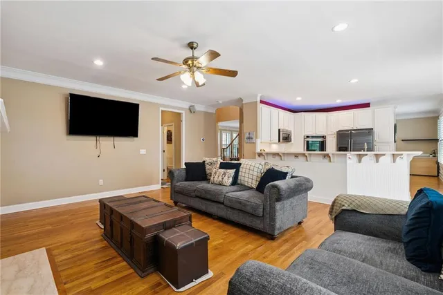 a kitchen with stainless steel appliances granite countertop a sink stove and microwave