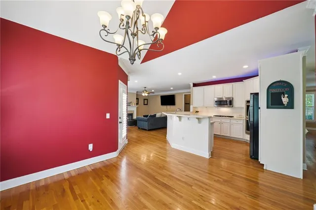 a kitchen with stainless steel appliances granite countertop a stove and a sink
