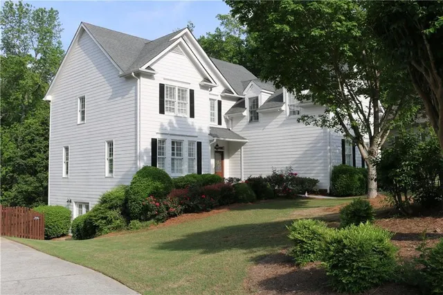 a view of entryway with wooden floor and stairs