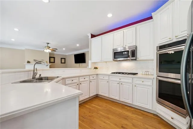 a view of entryway with wooden floor and a front door