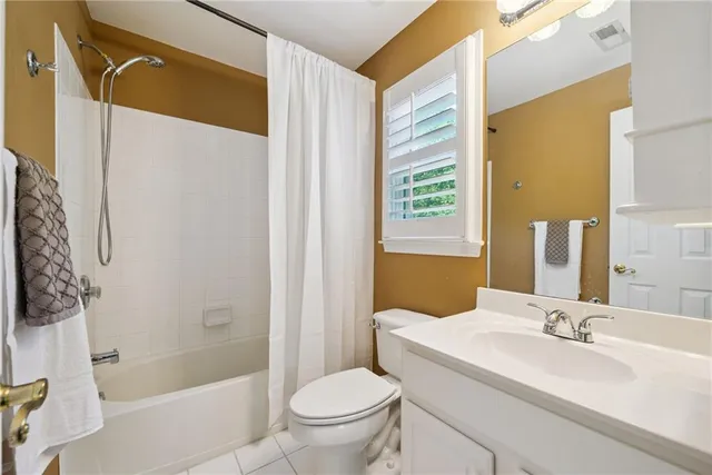 a view of a livingroom with an empty space and a flat screen tv