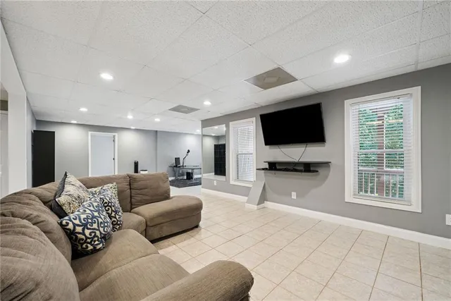 an aerial view of a house with yard swimming pool and outdoor seating