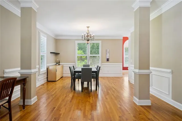 a view of a dining room with furniture window and wooden floor