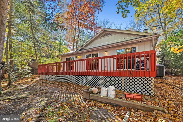 a view of balcony with wooden floor and fence