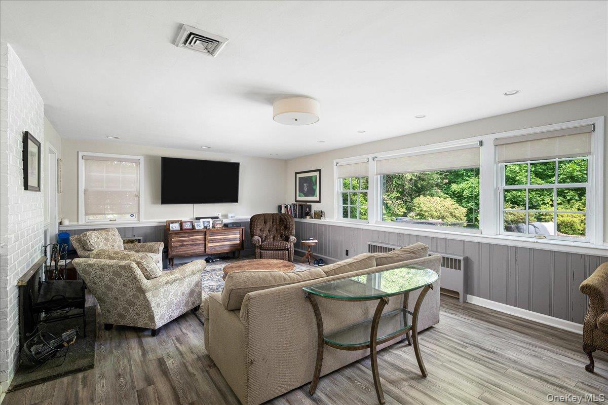 4 Wagon Wheel Road Mamaroneck, NY 10543 - Photo 16 of 26 a living room with furniture and a flat screen tv