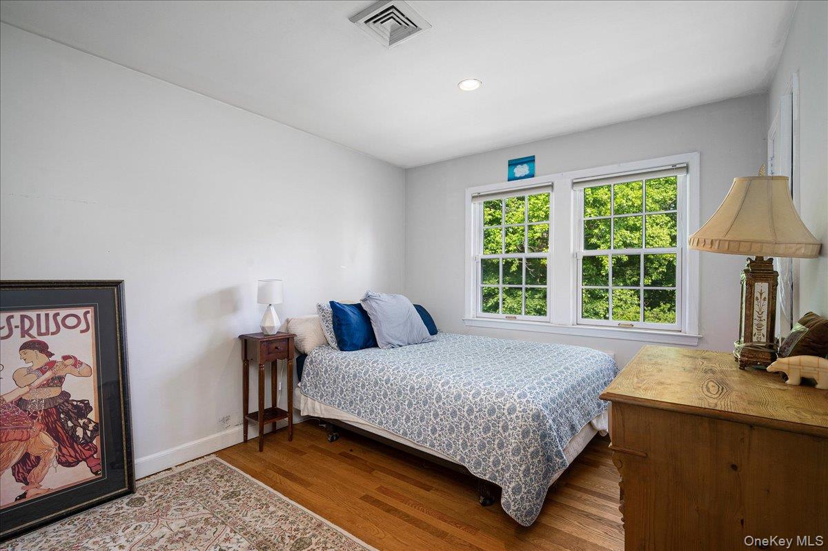 4 Wagon Wheel Road Mamaroneck, NY 10543 - Photo 17 of 31 Bedroom featuring wood finished floors and recessed lighting