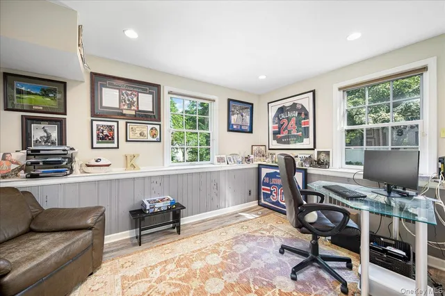 a work room with furniture and a window