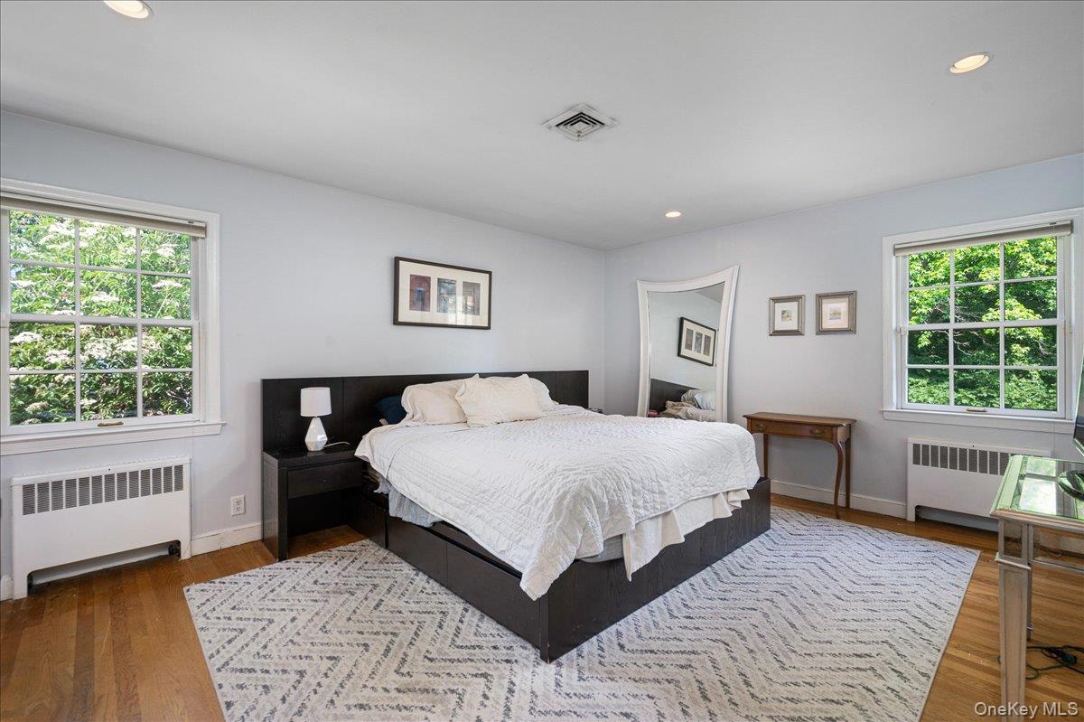 4 Wagon Wheel Road Mamaroneck, NY 10543 - Photo 10 of 26 a bedroom with a large bed and a window