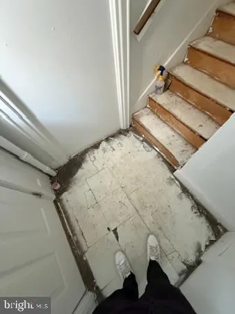 a view of staircase with a rug