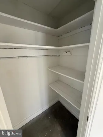 a room with two chairs and a window