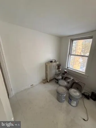 a view of an empty room with stairs