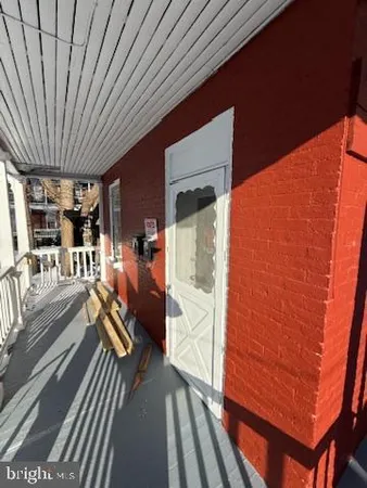 a view of a balcony with chairs