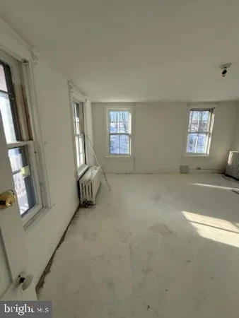 a bedroom with a bed and cabinets