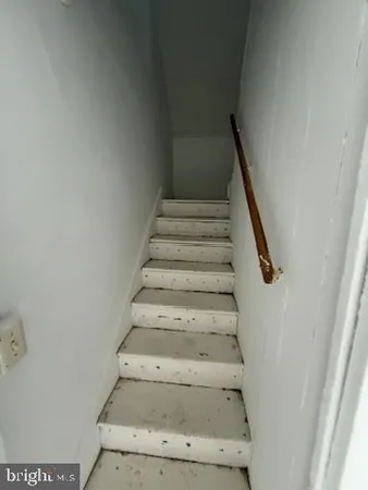 a bathroom with a sink and mirror with bathtub