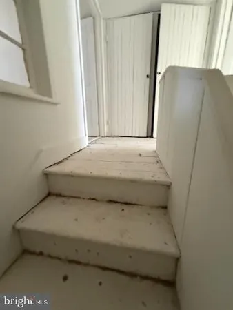 a view of entryway and hall with a sink