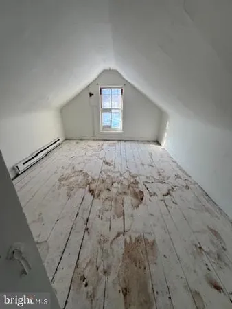 a bedroom with a bed and gym equipment