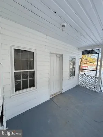 a view of backyard with seating space