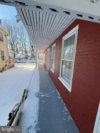 a view of balcony with wooden floor