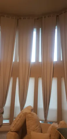 a view of an entryway with a floor to ceiling window