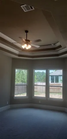 a view of an empty room and window