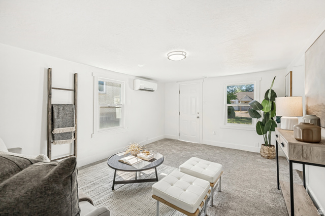 712 9th Street Ogden, UT 84404 - Photo 2 of 15 Inviting living space featuring light gray carpeting, white walls, and bright white trim