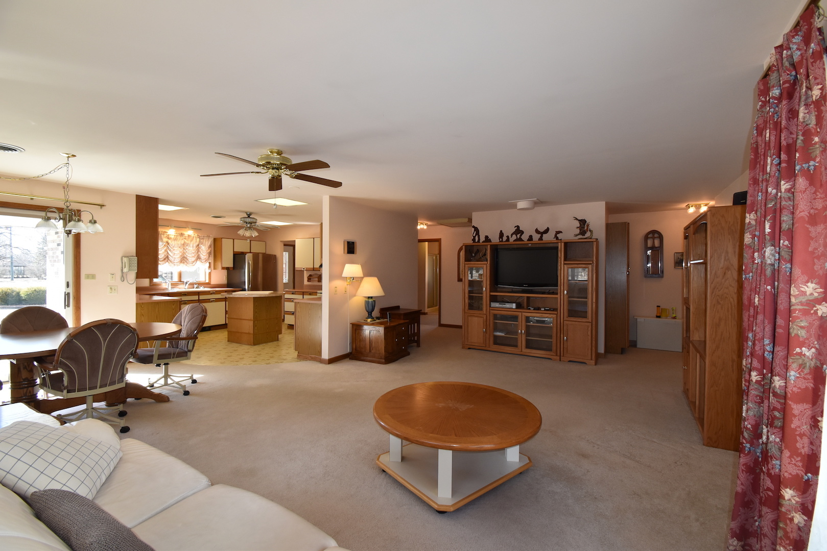 4496 West Sandwich Road Sandwich, IL 60548 - Photo 17 of 37 a living room with furniture and a flat screen tv