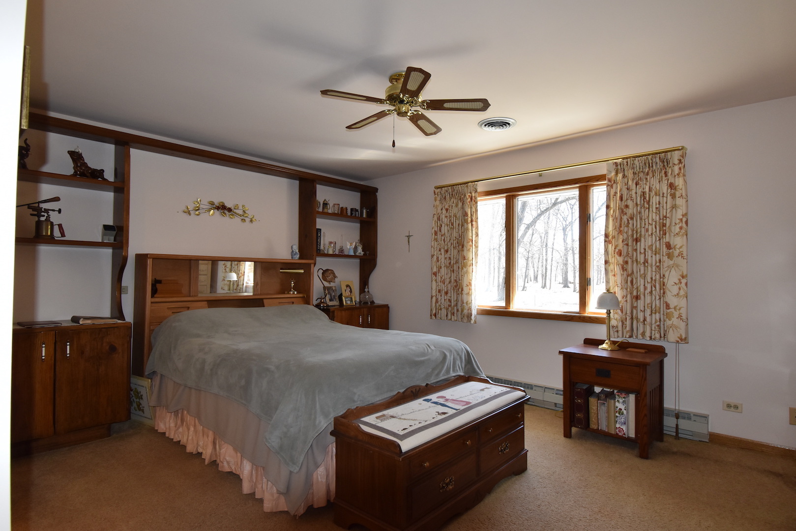 4496 West Sandwich Road Sandwich, IL 60548 - Photo 18 of 37 a bedroom with a bed and a chandelier