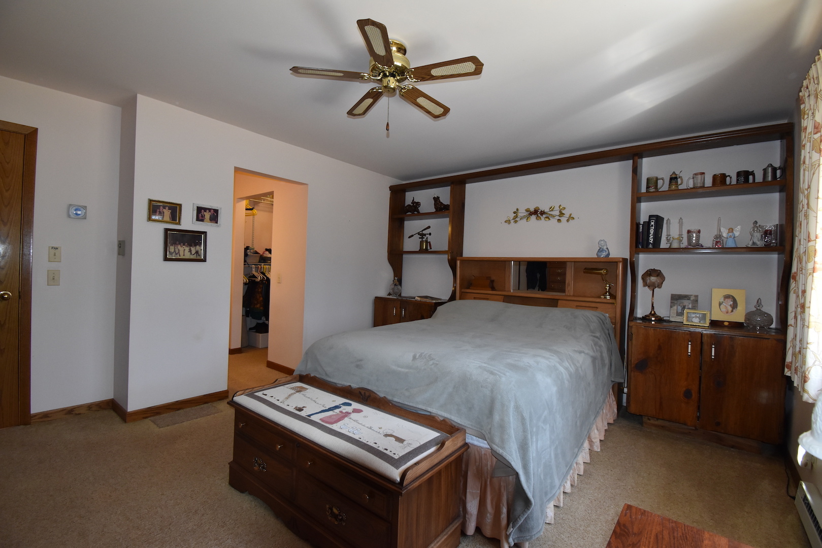 4496 West Sandwich Road Sandwich, IL 60548 - Photo 19 of 37 a bedroom with a bed and a chandelier