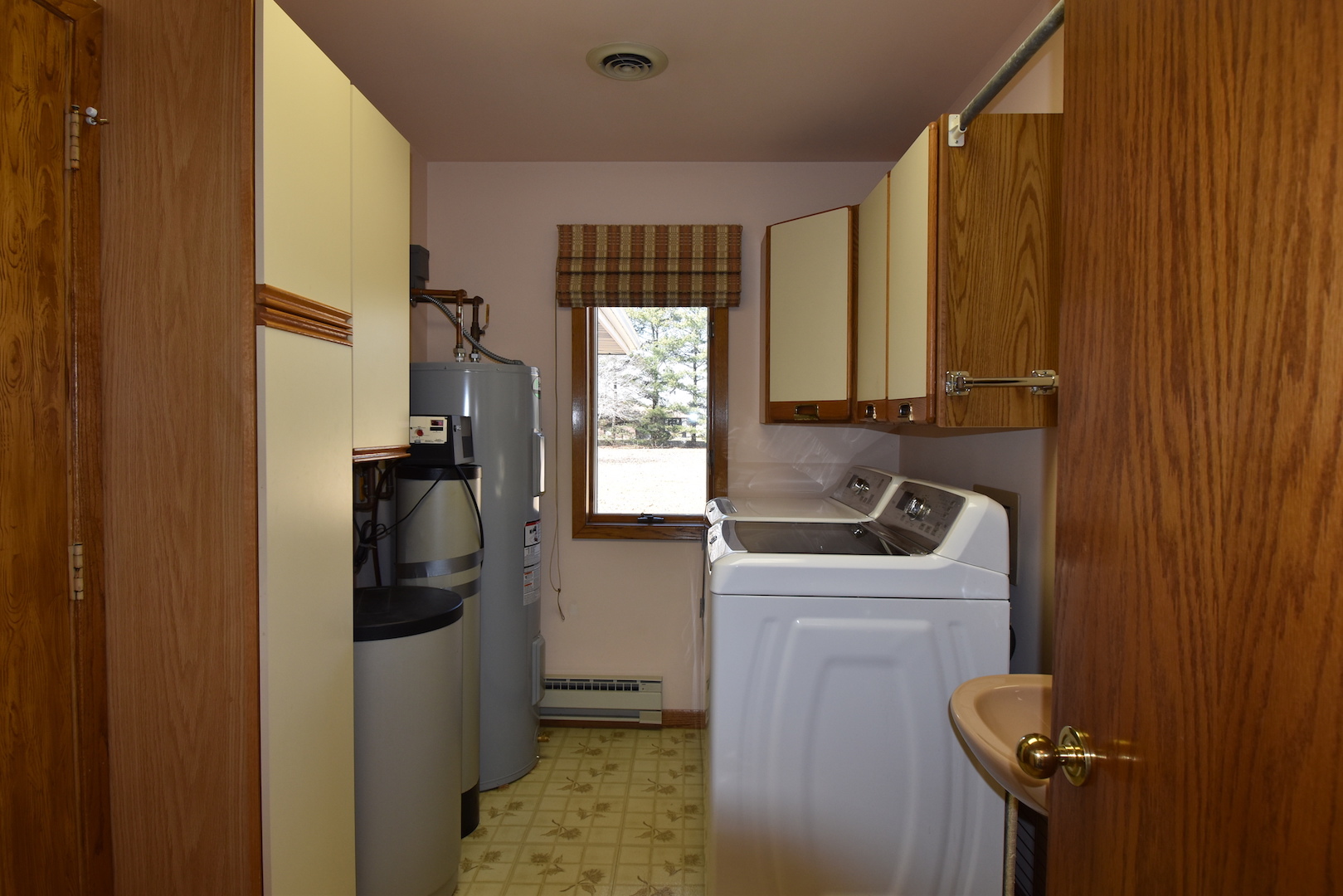 4496 West Sandwich Road Sandwich, IL 60548 - Photo 25 of 37 a bathroom with a sink a window and a shower