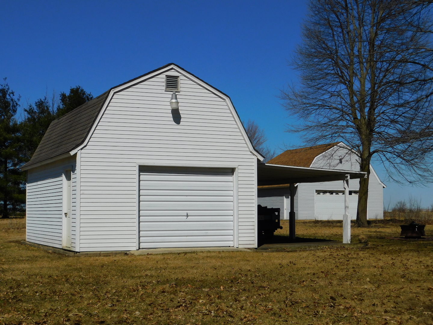 4496 West Sandwich Road Sandwich, IL 60548 - Photo 31 of 37 a view of a house with a garage
