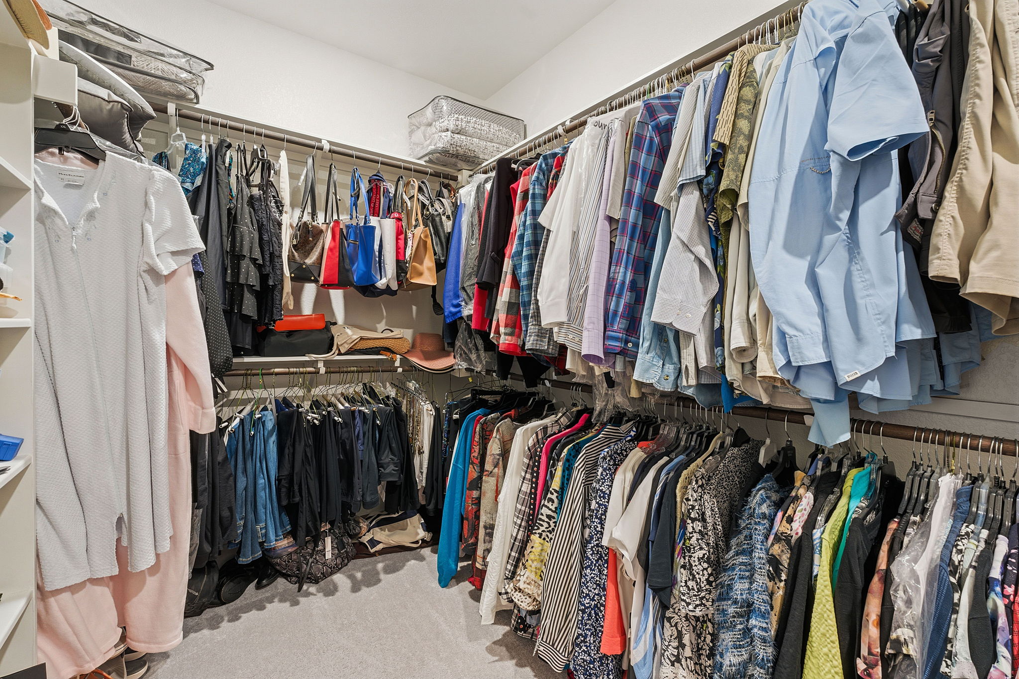 18917 Grape Seed Cove Austin, TX 78738 - Photo 11 of 33 Walk in closet featuring light colored carpet