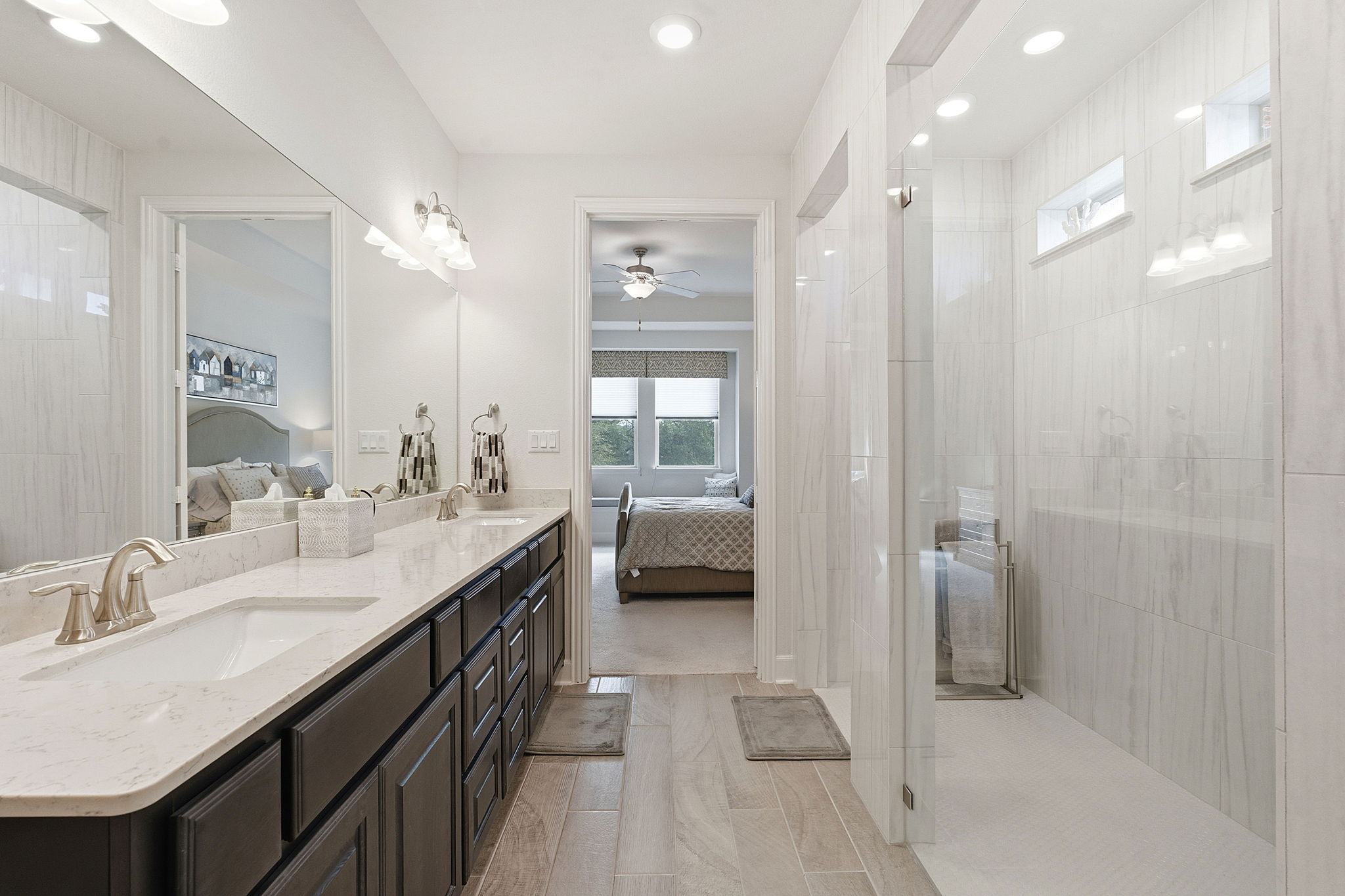 18917 Grape Seed Cove Austin, TX 78738 - Photo 12 of 33 Ensuite bathroom with walk in shower, double vanity, a ceiling fan, and recessed lighting