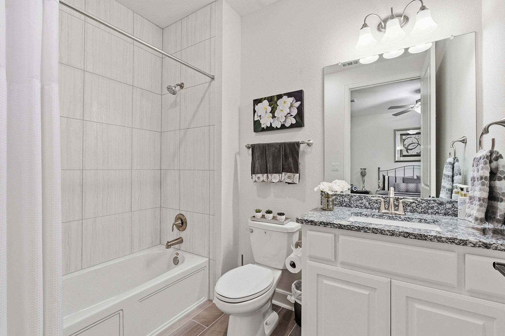 18917 Grape Seed Cove Austin, TX 78738 - Photo 14 of 33 Full bathroom with shower / bath combo, vanity, and ceiling fan