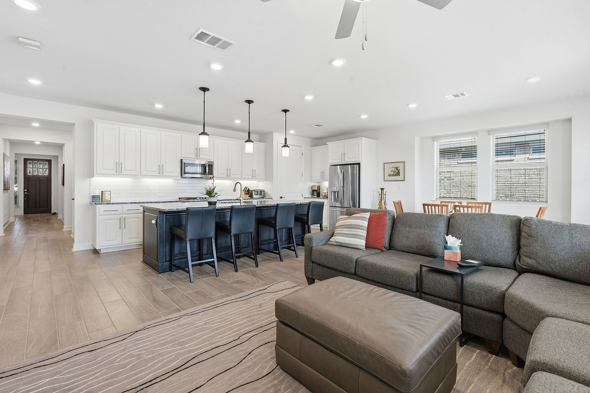18917 Grape Seed Cove Austin, TX 78738 - Photo 17 of 33 Living room with recessed lighting, light wood-style flooring, and ceiling fan