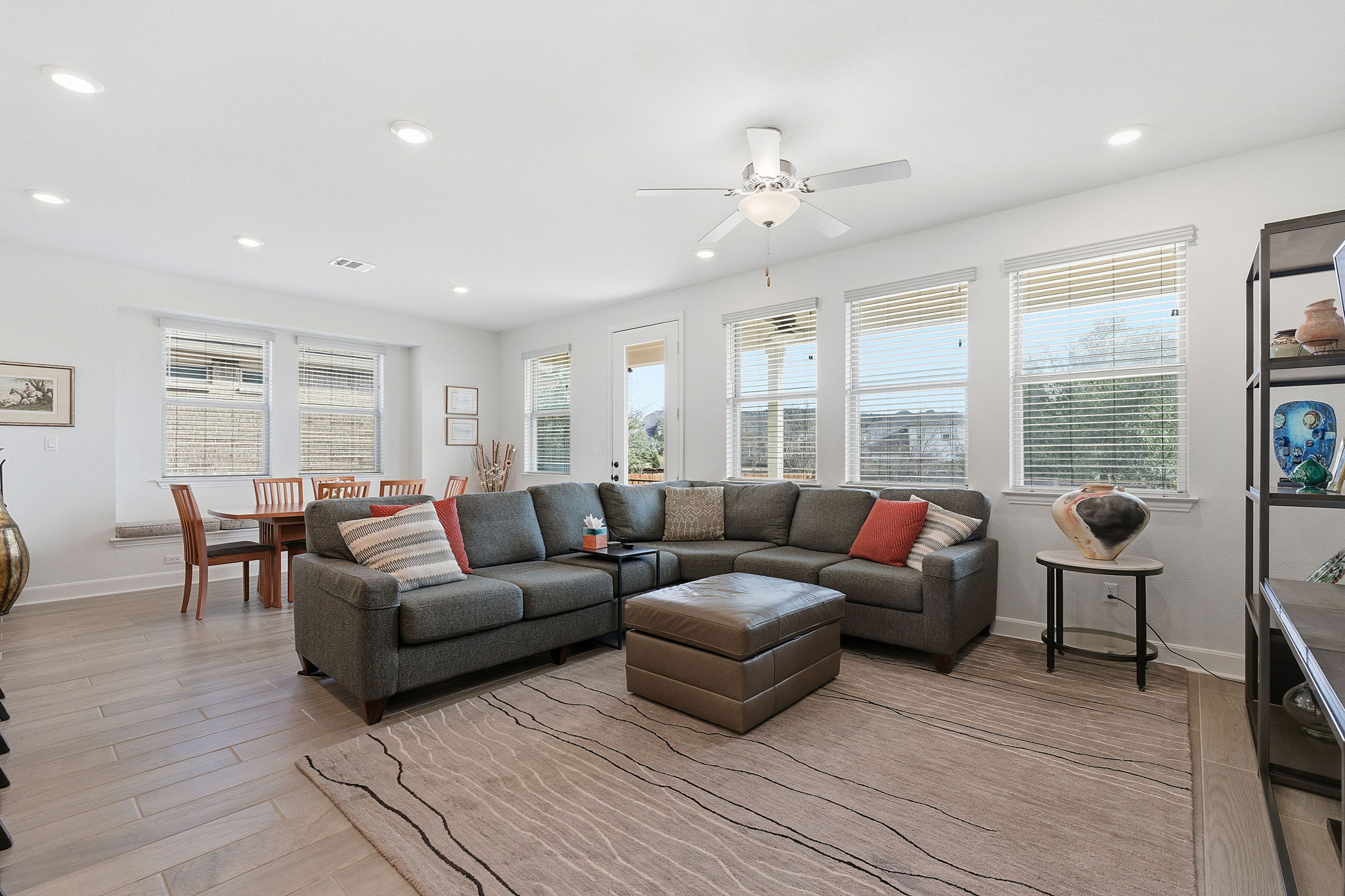 18917 Grape Seed Cove Austin, TX 78738 - Photo 7 of 33 Living area with light wood-type flooring, recessed lighting, and ceiling fan