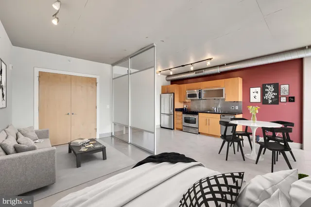 a bedroom with furniture and a wooden floor