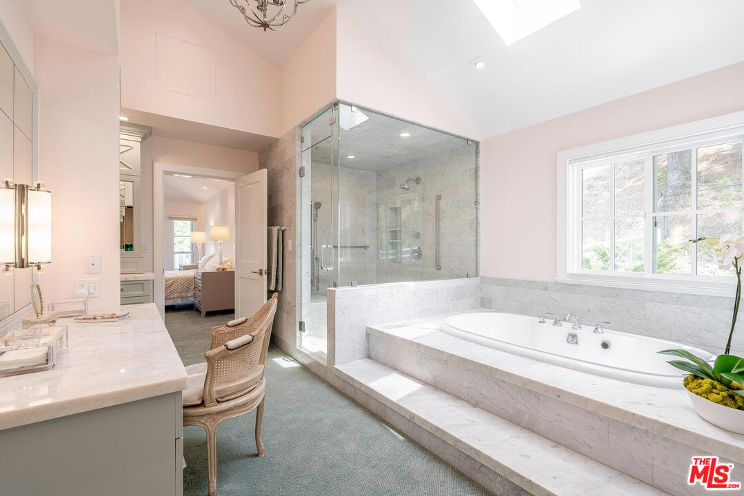 10821 Savona Road Los Angeles, CA 90077 - Photo 16 of 26 a bathroom with a bathtub and a sink