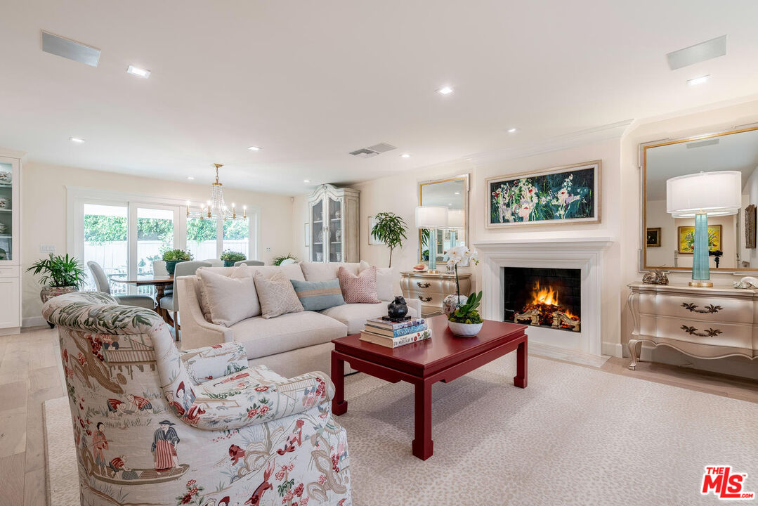 10821 Savona Road Los Angeles, CA 90077 - Photo 5 of 26 a living room with furniture and a fireplace